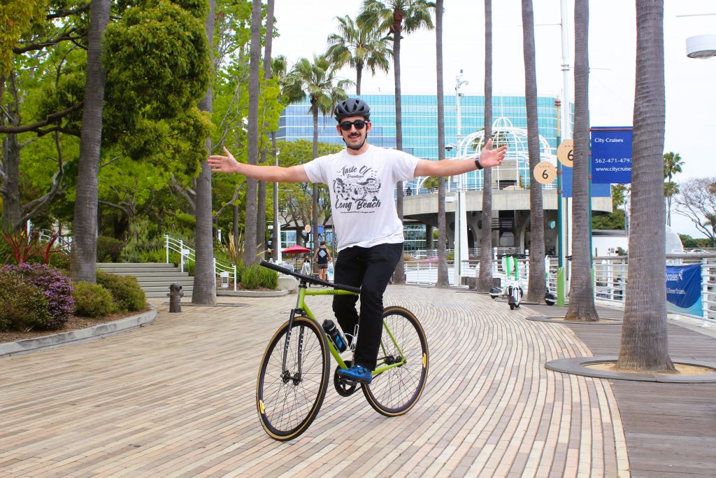 Morris Mills balancing on his bike near the Waterfront
